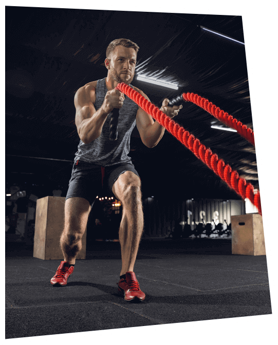 man training hard with rope